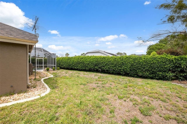 6112 Kinlock Ave, Spring Hill, FL 34608 - view of green lawn with a lanai