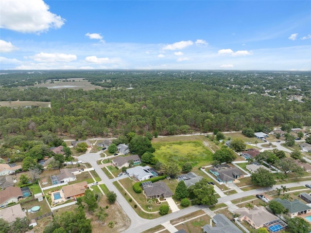 6112 Kinlock Ave, Spring Hill, FL 34608 - aerial view of property and surrounding area featuring a forest and nearby suburban area
