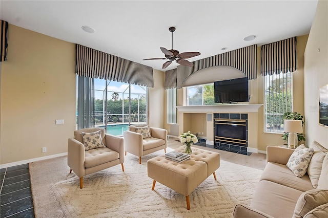 6112 Kinlock Ave, Spring Hill, FL 34608 - tiled living area with ceiling fan and a tile fireplace
