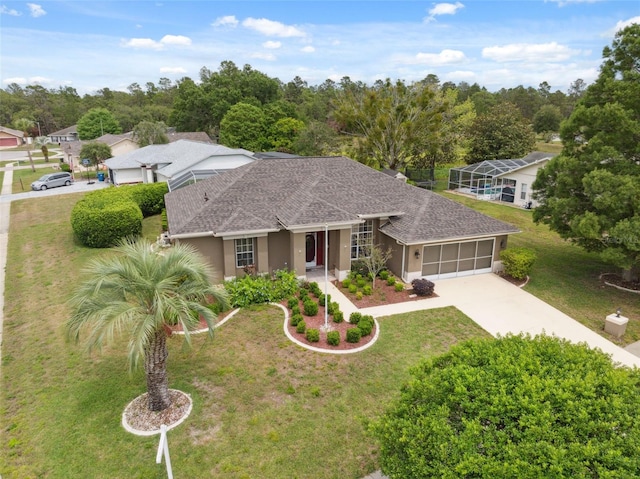 6112 Kinlock Ave, Spring Hill, FL 34608 - ranch-style house featuring a front lawn, a shingled roof, a garage, stucco siding, and driveway