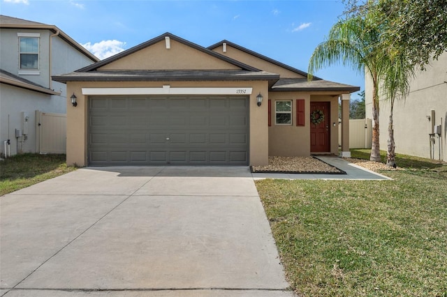 view of front of home featuring a garage and a front yard