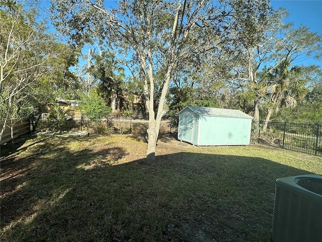 view of yard with cooling unit and a storage shed