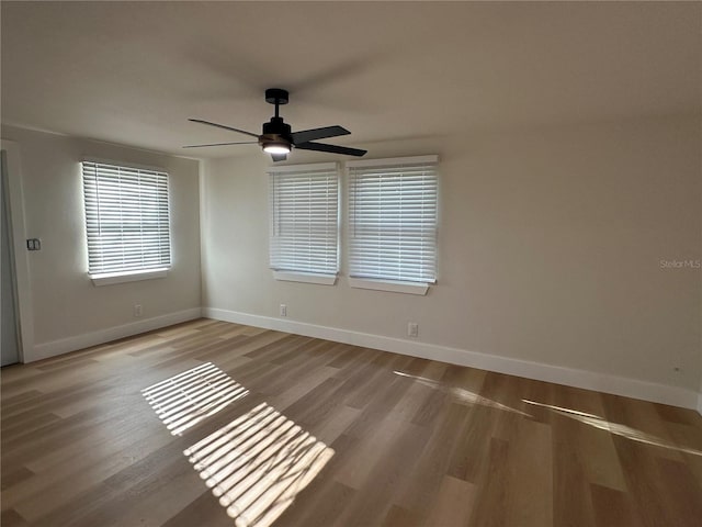 unfurnished room featuring ceiling fan and light wood-type flooring