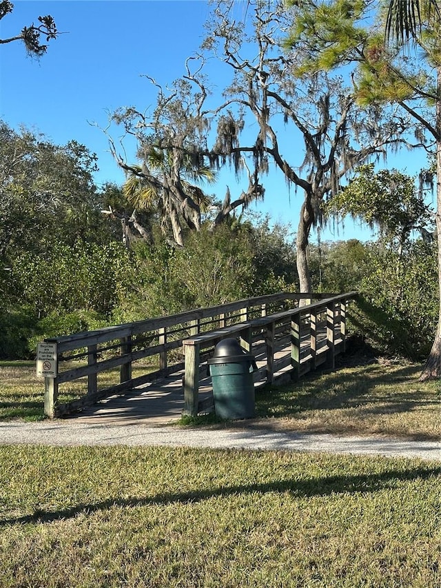 view of property's community featuring a lawn