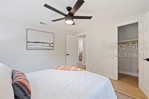 bedroom with ceiling fan and light wood-type flooring