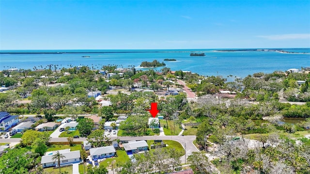 birds eye view of property featuring a water view and a residential view