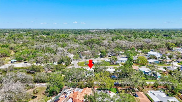 birds eye view of property with a wooded view