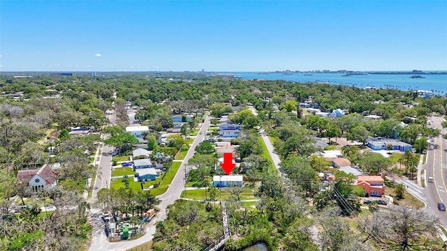 drone / aerial view featuring a water view and a residential view