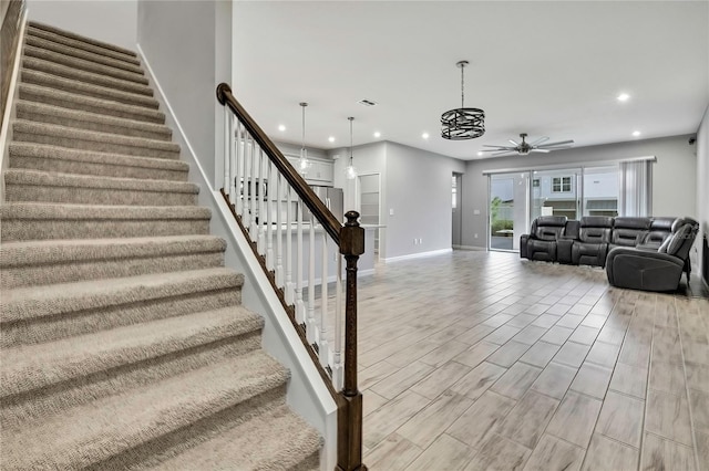 living room featuring ceiling fan and hardwood / wood-style floors