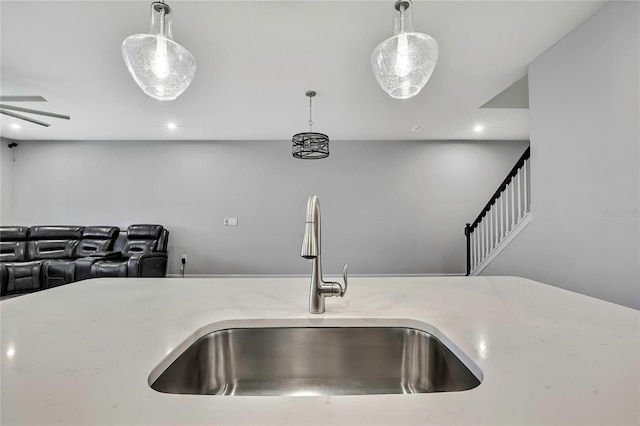 room details featuring decorative light fixtures and sink