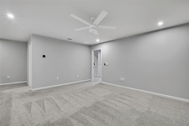 spare room featuring carpet and ceiling fan