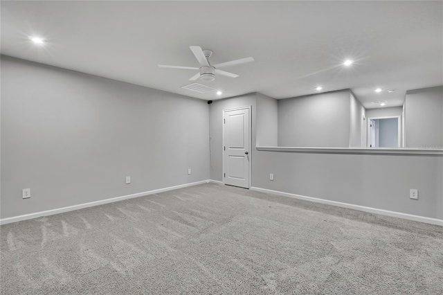 empty room featuring ceiling fan and carpet flooring