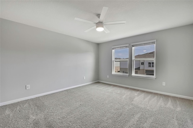 unfurnished room with carpet flooring, a textured ceiling, and ceiling fan