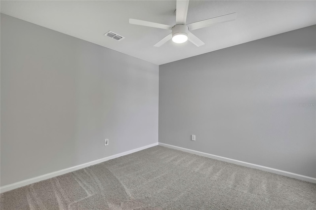 empty room with carpet and ceiling fan