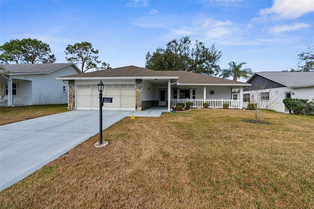 ranch-style home featuring a garage, covered porch, and a front lawn