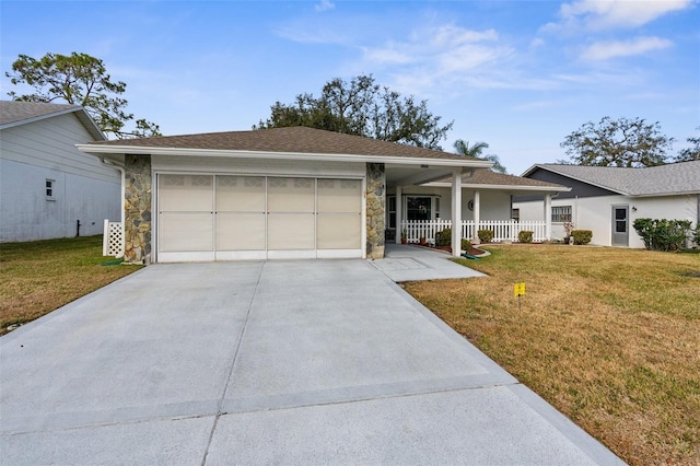 ranch-style home featuring a garage, a front yard, and a porch