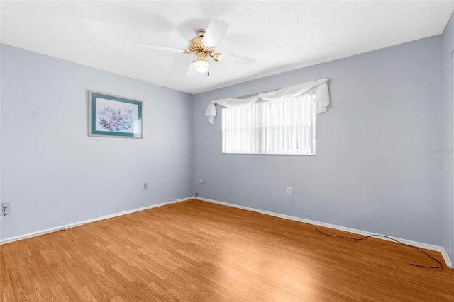 unfurnished room featuring ceiling fan and light wood-type flooring