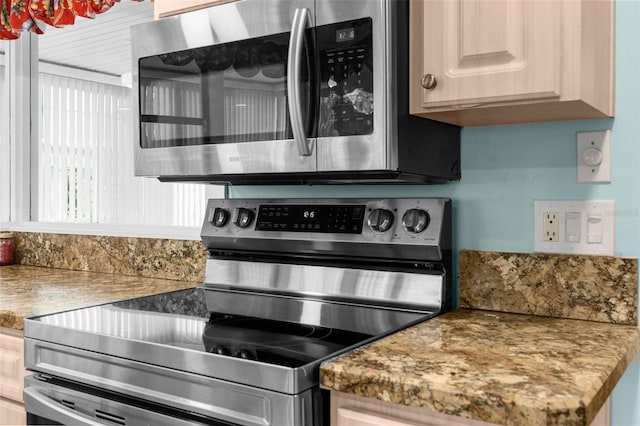 kitchen with appliances with stainless steel finishes and light brown cabinetry