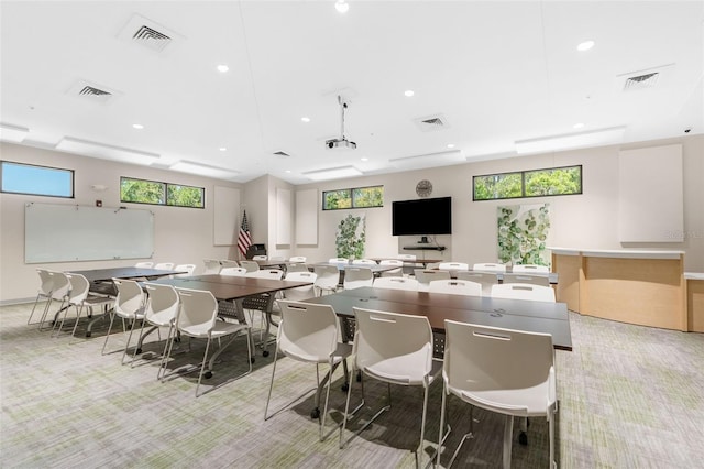 dining room featuring light carpet