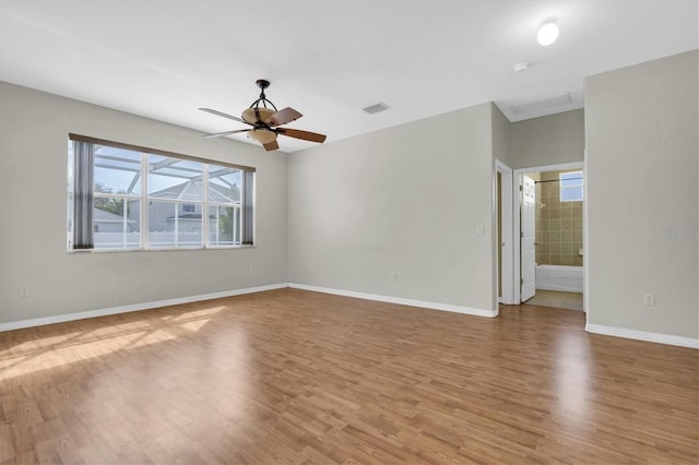 unfurnished room featuring ceiling fan and hardwood / wood-style floors