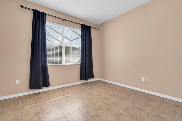 empty room featuring light tile patterned floors