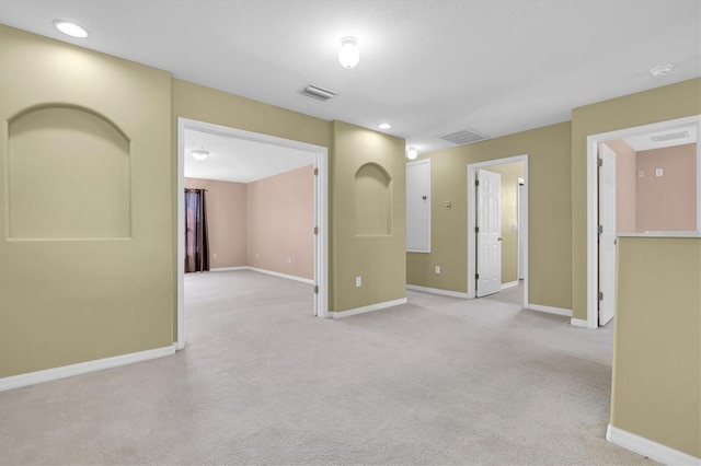 empty room with light colored carpet