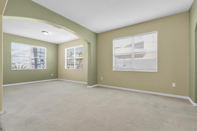 spare room with light colored carpet