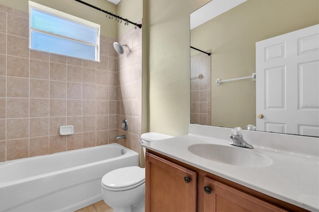 full bathroom with vanity, toilet, tile patterned floors, and tiled shower / bath