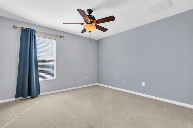 unfurnished room featuring ceiling fan and carpet flooring