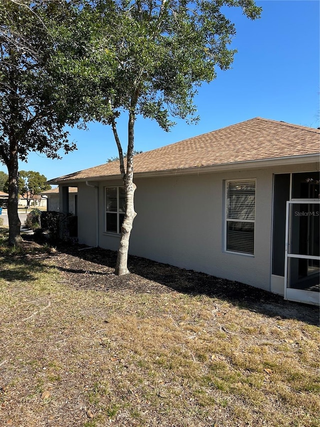 view of home's exterior featuring a lawn