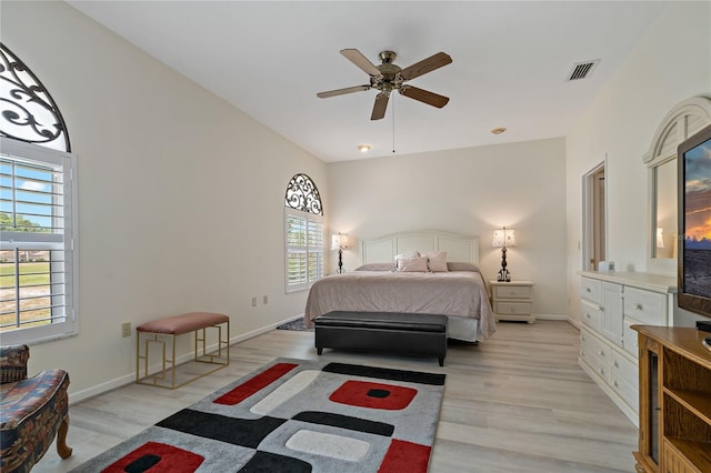 bedroom featuring light hardwood / wood-style floors and ceiling fan