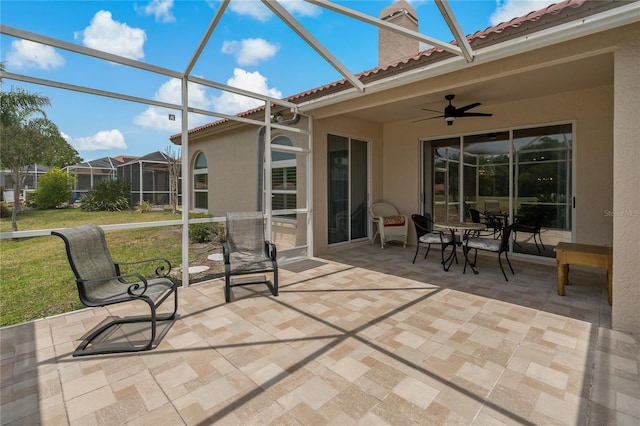 sunroom / solarium with ceiling fan