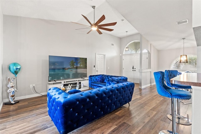 living room featuring hardwood / wood-style flooring, ceiling fan, and lofted ceiling