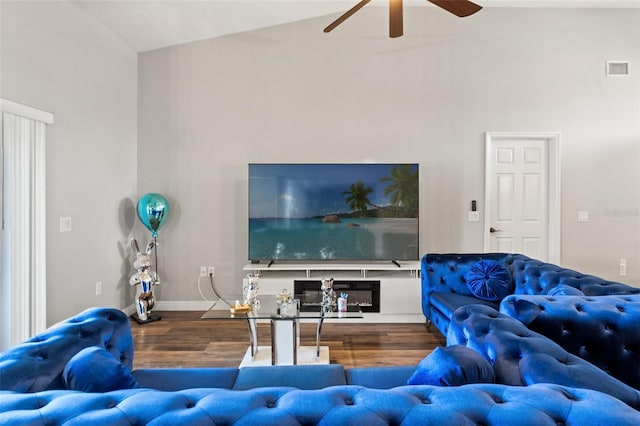 living room featuring lofted ceiling, hardwood / wood-style floors, and ceiling fan