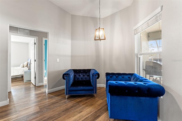 living area with dark hardwood / wood-style floors