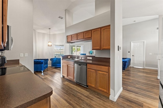 kitchen with sink, dishwasher, high vaulted ceiling, dark hardwood / wood-style flooring, and decorative light fixtures