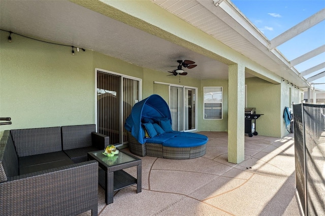 view of patio featuring outdoor lounge area, ceiling fan, and grilling area