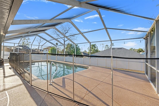 view of swimming pool with a lanai and a patio area