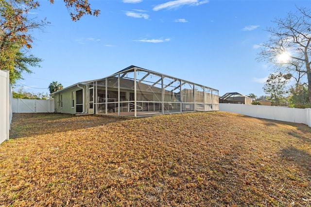 back of property with glass enclosure