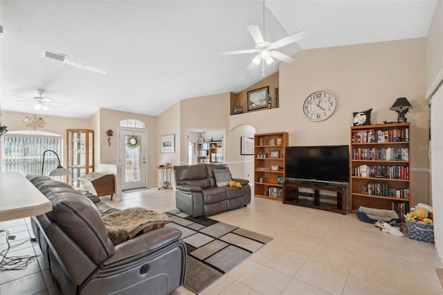 living room featuring light tile patterned floors, vaulted ceiling, and ceiling fan