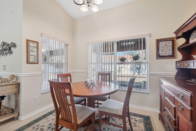 dining space featuring an inviting chandelier and light tile patterned floors