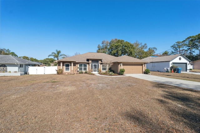 ranch-style home featuring a garage and a front lawn