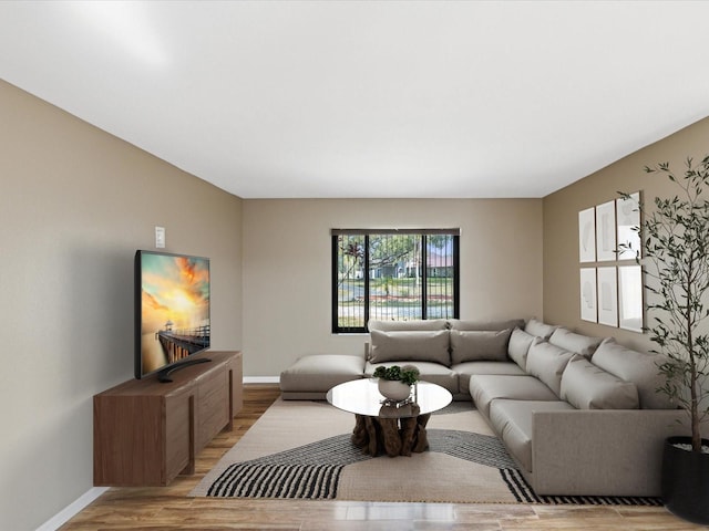 living room featuring light wood-style flooring and baseboards