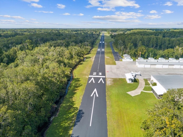 birds eye view of property with a forest view