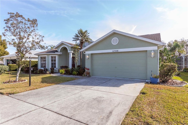 single story home featuring a garage and a front lawn