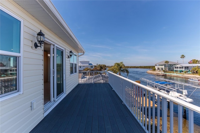 wooden deck featuring a water view