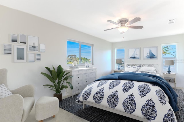 carpeted bedroom featuring ceiling fan