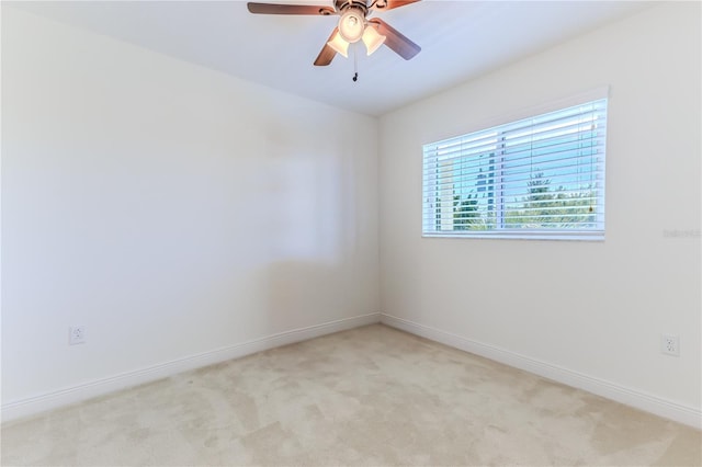 unfurnished room with light carpet and ceiling fan