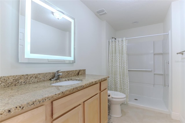 bathroom with tile patterned flooring, vanity, walk in shower, and toilet