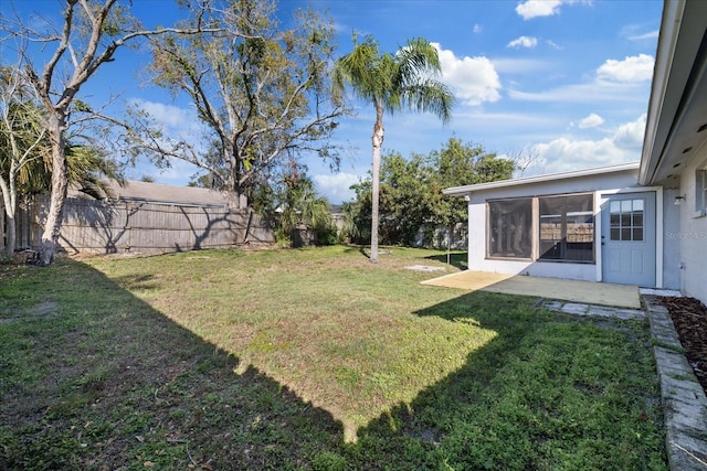 view of yard featuring a sunroom